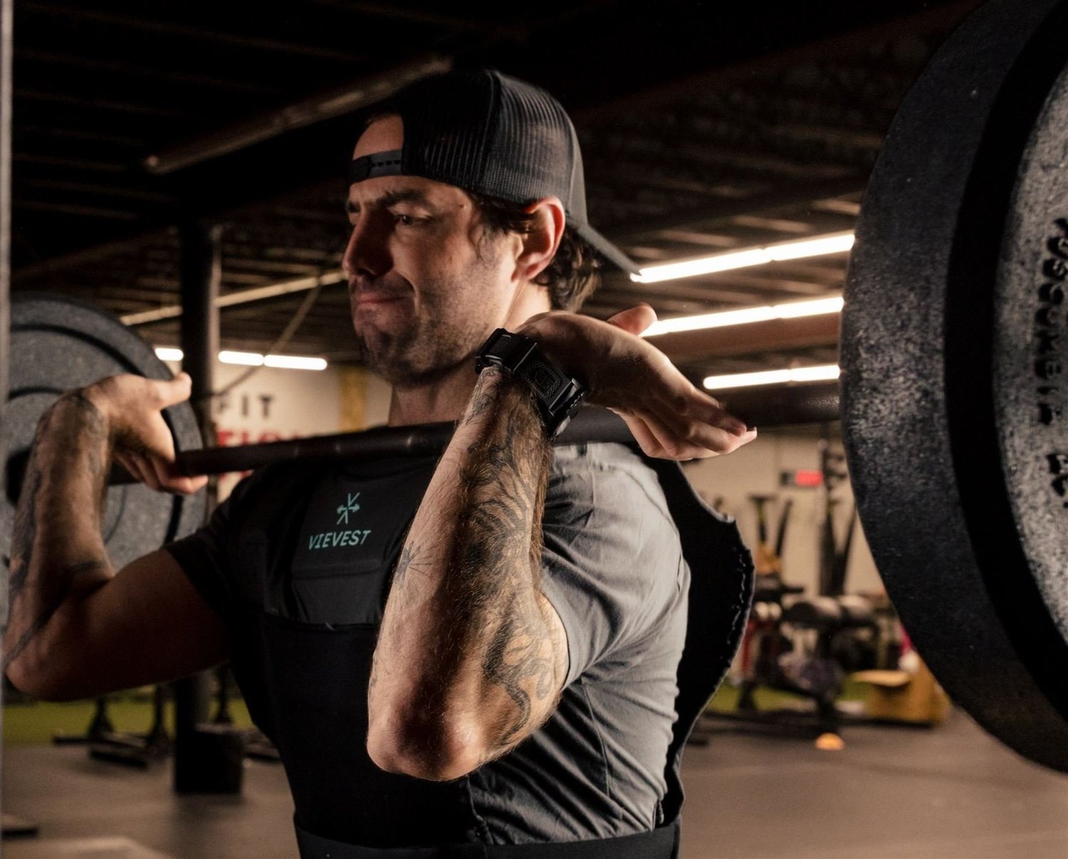 Athlete wearing VieVest with a barbell in the front rack